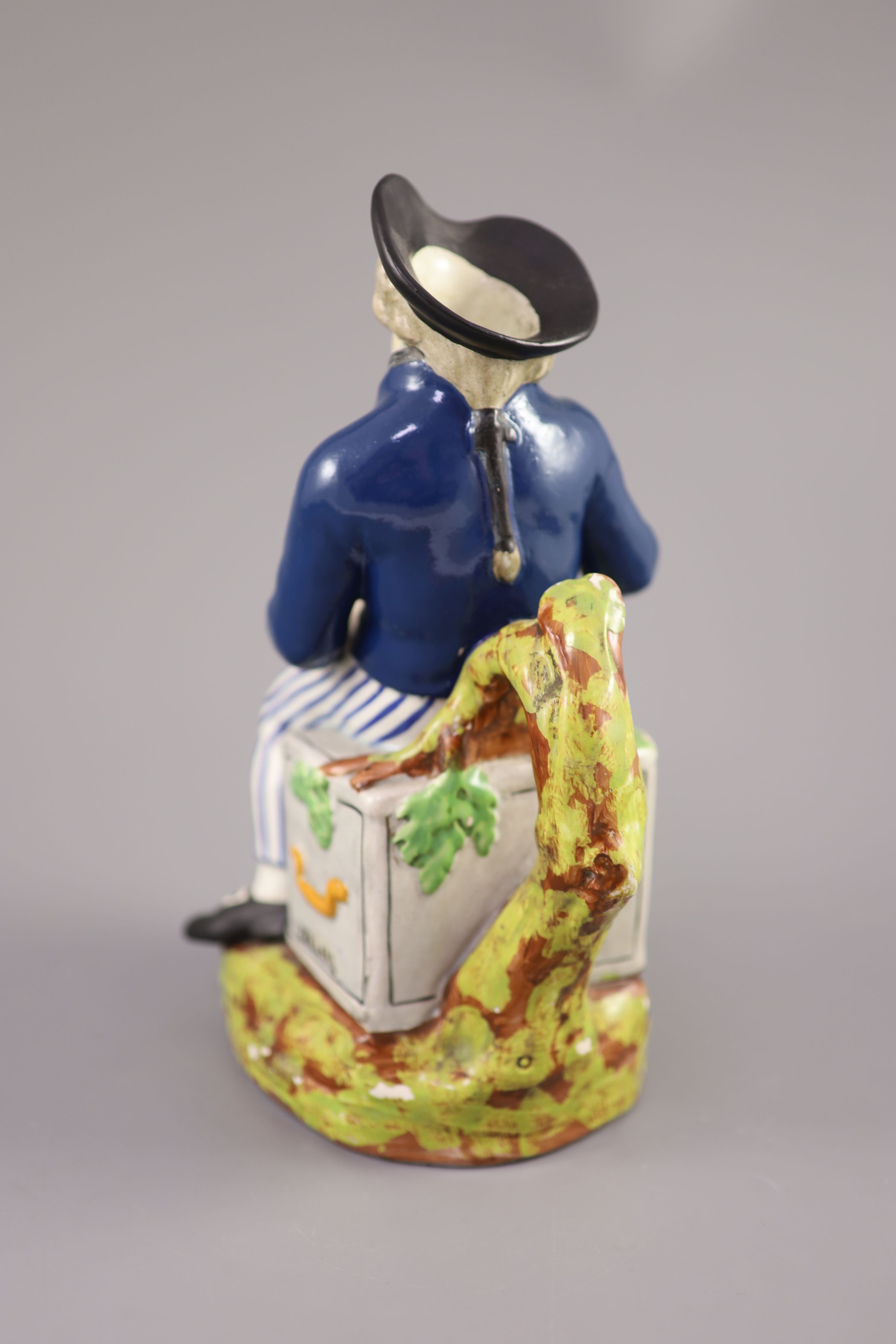 An American Pearlware sailor Toby jug with hat, Success to our Wooden Walls, c.1820, 27cm high